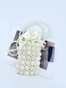 Elegant white pearl beaded bucket bag with drawstring silk lining and pearl strap