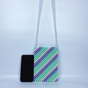 Detail view of handmade beaded crossbody bag with green and purple diagonal pattern