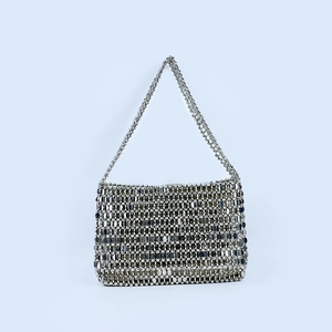Detail of silver metallic sequin shoulder bag featuring handmade woven disco design
