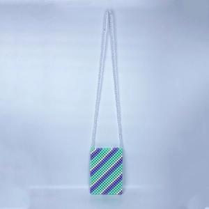 Macro detail of handmade beaded crossbody bag showing mint and lilac diagonal pattern
