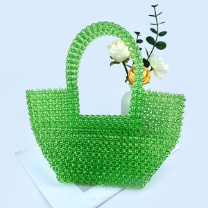 Detailed view of emerald green transparent acrylic beaded handbag with manual weaving