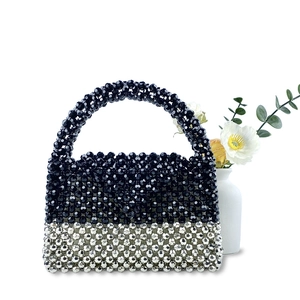 Detailed shot of handmade beaded handbag with silver and black contrast color beadwork