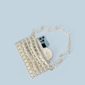 Close-up of handmade beaded pearl handbag with silk lining and internal storage space