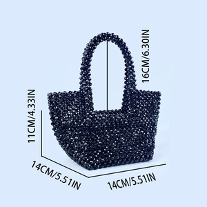 Detailed view of handmade black beaded handbag dimensions and polished geometric texture