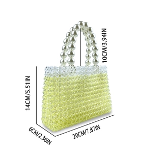 Detailed view of handmade beaded tote bag dimensions with large pearl handle
