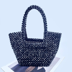 Detailed view of the handcrafted black faceted bead texture on this elegant handbag