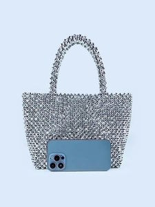 Elegant silver beaded handbag with shimmering metallic texture for evening parties
