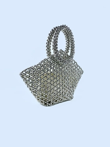 Handmade silver beaded tote bag with circular handles and minimalist woven structure
