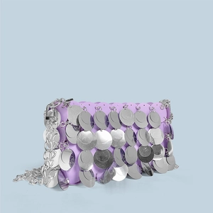 Detail of silver sequins and metal chain strap on a shimmering purple party clutch bag