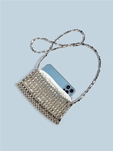 Silver metallic sequin crossbody bag handcrafted with beads showing phone storage capacity