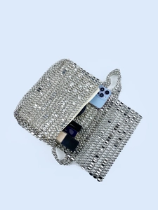 Silver sequin woven handbag with metal link design and inner zipper pocket