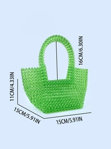 Green transparent acrylic beaded handbag with measurements on light blue background
