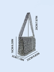 Handmade silver beaded shoulder bag with dimensions 25x16x3 cm and metal bead texture