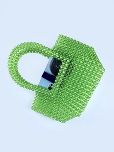 Transparent green acrylic beaded handbag with spacious interior and matching top handle