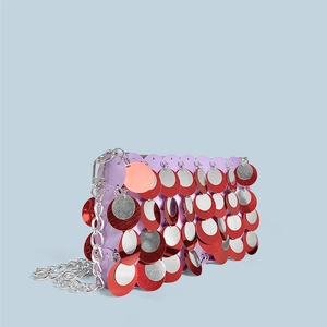 Detail of purple sequin bag with silver chain strap and sparkling red silver discs