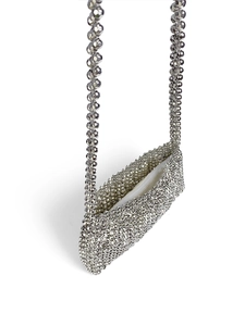 Detail of hand-woven silver beaded mini crossbody bag with metallic faceted beads and chain