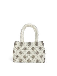 Detailed close-up of handmade white pearl beaded handbag with silver diamond pattern