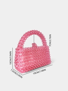 Sac à main artisanal en perles de cristal rose avec texture acrylique élégante