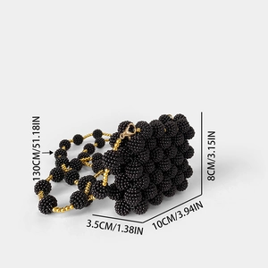 Detail of mini black beaded handbag with 130cm strap and lobster clasp dimensions