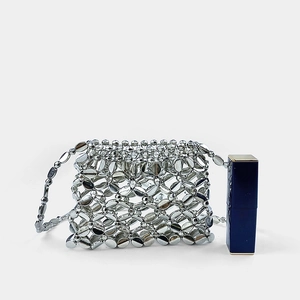 Mini silver beaded bag detail with lip gloss for scale showing the tiny dimensions