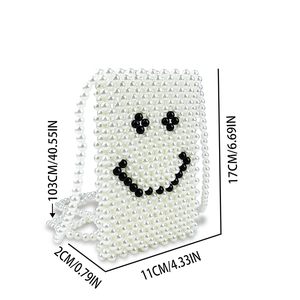 Detailed dimensions of handmade pearl woven crossbody bag with cute black smiley face icon