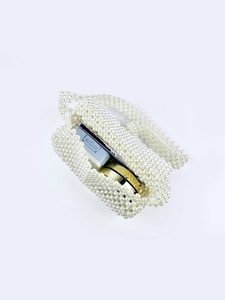 Detailed interior view of handmade beaded tote bag showing storage space for small items