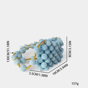 Mini light blue beaded bag with dimensions 10x3.5x8cm and a long gold chain strap