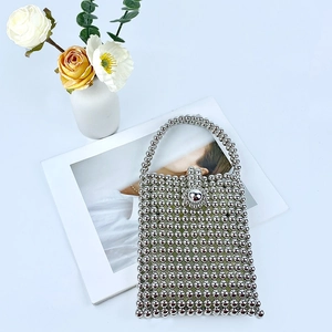 Top view of silver beaded handbag with vintage square frame and spherical bead clasp