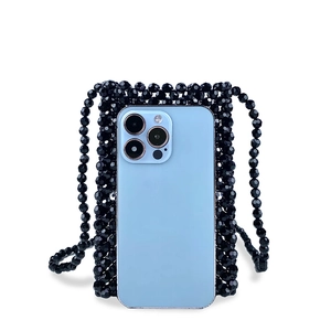 Detailed view of handmade black beaded mobile phone bag with glossy woven texture