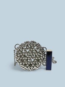 Chic silver handmade beaded ball bag with chain strap against light blue background
