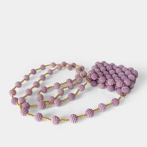 Detail of lavender handmade beaded mini bag featuring intricate texture and gold clasp