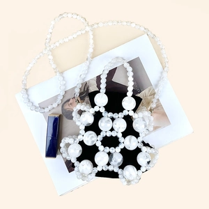 Top view of creative beaded bucket bag with marble texture beads and black inner pouch