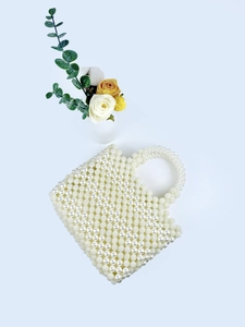 Handmade woven pearl sphere evening handbag with luxurious white beaded design