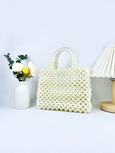 Elegant handmade pearl woven handbag with a round handle for formal dinner parties