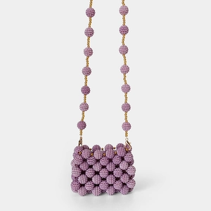 Macro view of purple handmade beaded mini bag with detailed spherical texture and gold chain