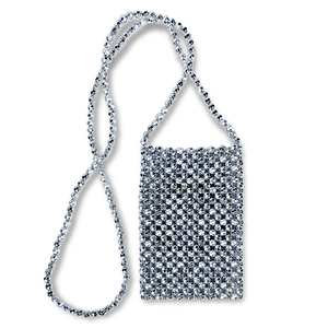 Detail of silver beaded mini crossbody bag with metallic woven texture and long strap