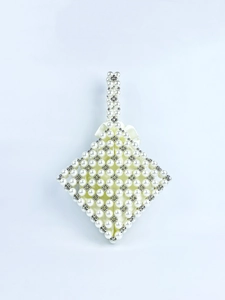 Detailed view of pearl beaded handbag with satin lining and decorative bow handle