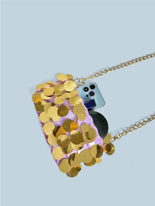 Sparkling purple sequin shoulder bag with gold chain showing interior capacity for essentials