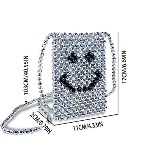 Detail of silver beaded handmade phone bag showing 17cm height and smiley face pattern