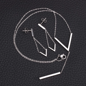 Detailed view of silver stainless steel V-shape tassel necklace and earrings jewelry set