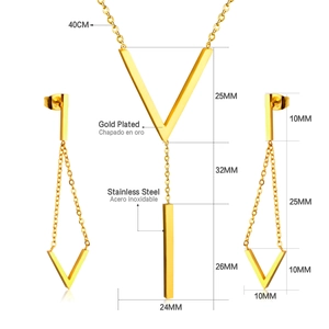 Detail of gold V-shaped necklace and geometric tassel earrings stainless steel jewelry set