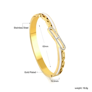 Detailed size view of gold plated stainless steel bangle with white enamel and crystals
