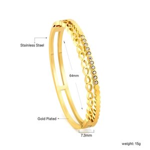 Macro detail of 18K gold plated stainless steel bangle with infinity motif and white stones