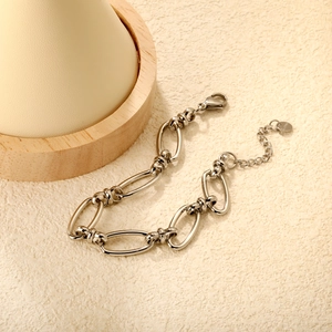 Minimalist silver chain bracelet with twisted knot links and adjustable lobster clasp