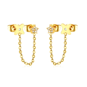 Golden flower and star chain earrings with sparkling cubic zirconia on white background
