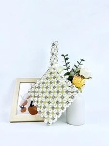 Elegant pearl beaded handbag with rhombus pattern and silver metal beads detail