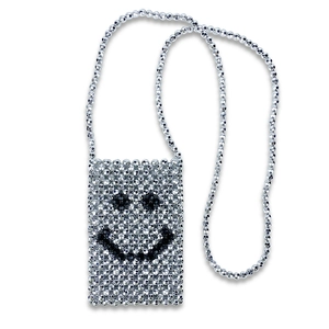 Macro detail of silver beaded crossbody bag featuring a handmade woven smiley face pattern