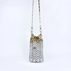 Detail of handmade gold and silver metallic sequins woven mini crossbody phone bag