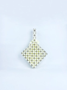 Macro detail of hand-woven acrylic pearl beads and silver metallic accents on a bag