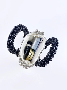 Internal view of handmade black and silver beaded handbag showing storage capacity